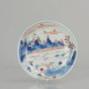 0741 A delicate small dish with a landscape scene in imari enamels.
