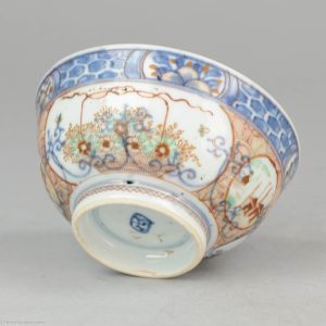 0291. Amsterdams Bont bowl. blue and white china, decorated in Europe. Here decorated with populair setting of a flower basket and fisherman.