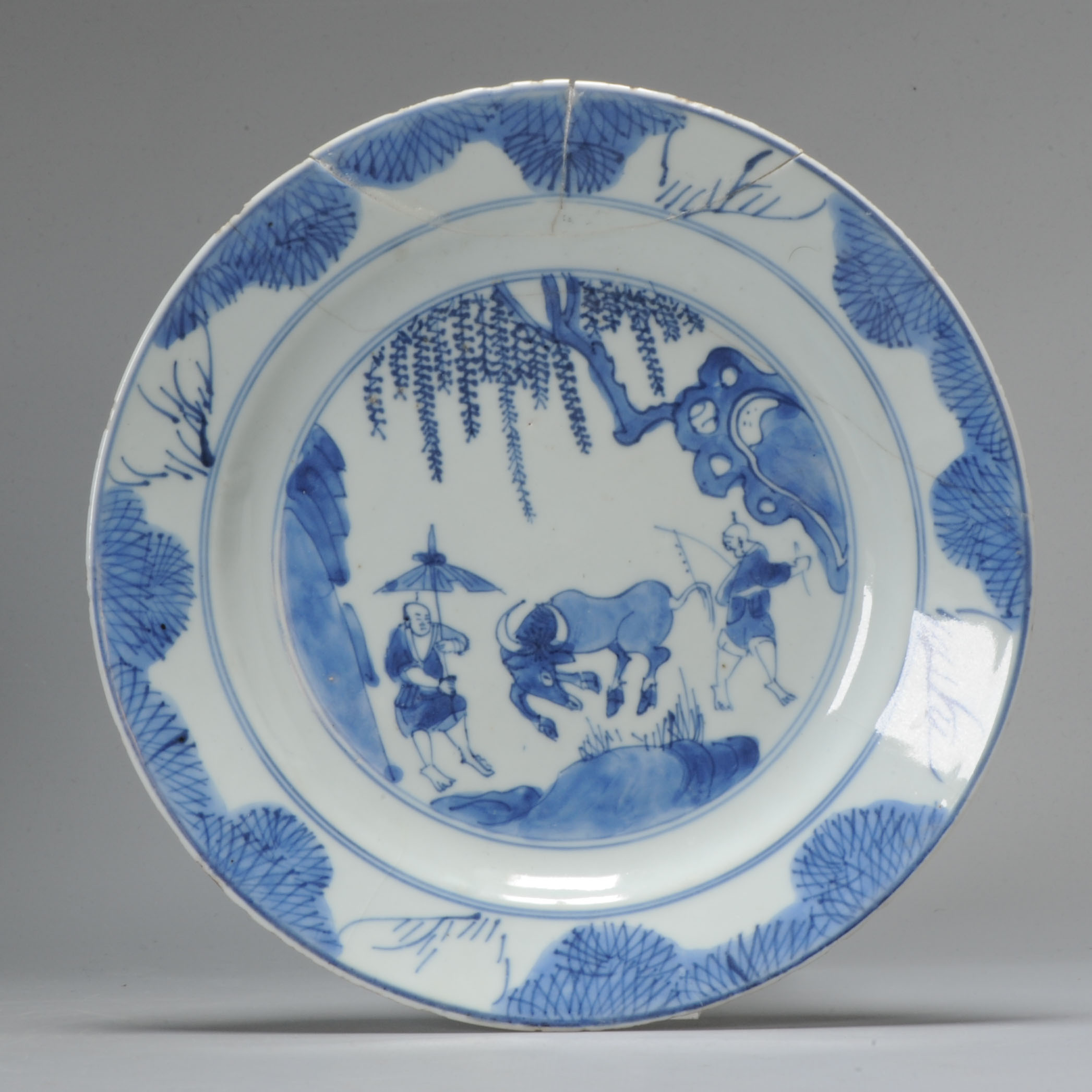 1019 Lovely cobalt blue plate with Figures and Ox. Very much in Ming style on the rim and base