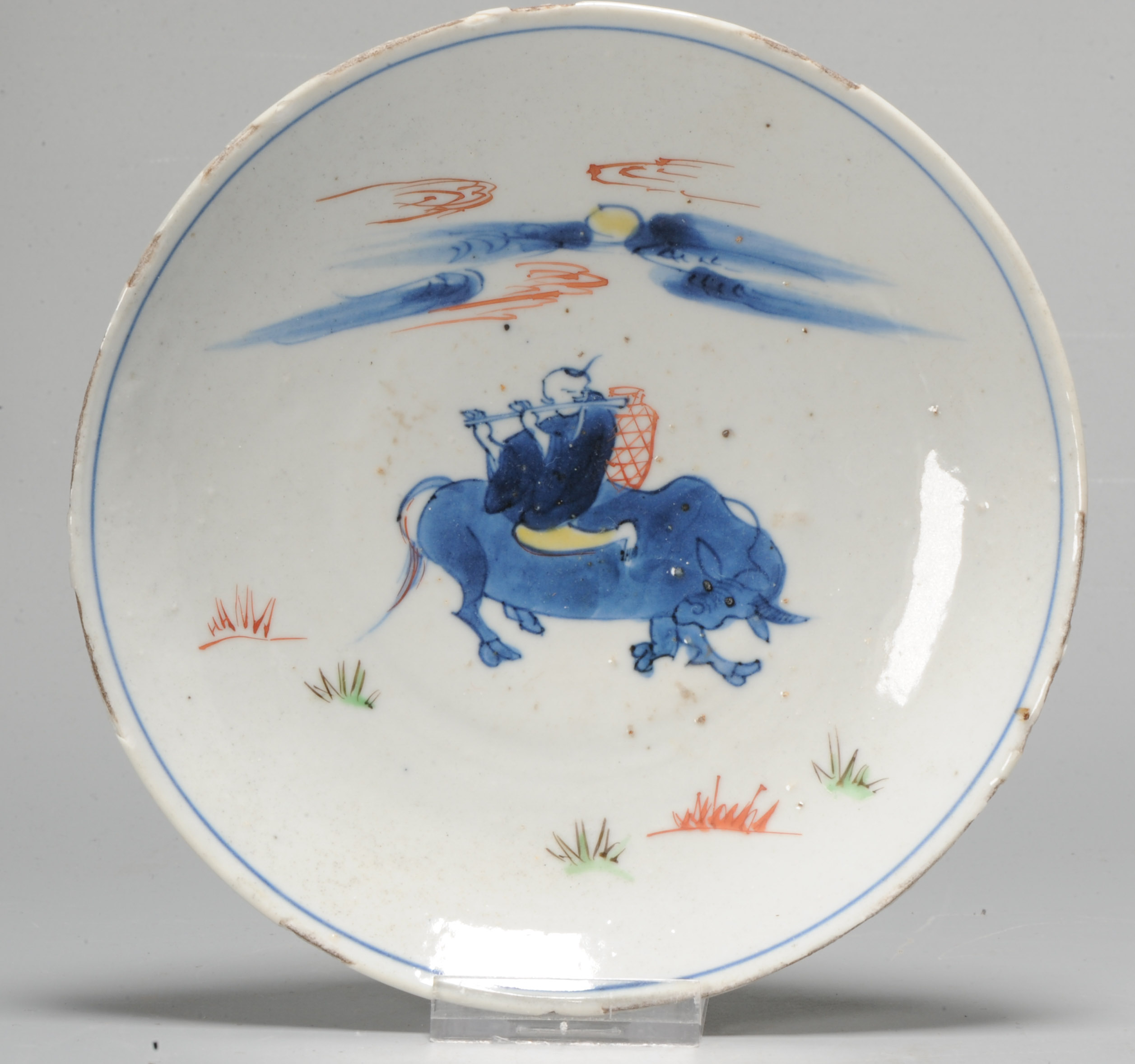 1048 A Chinese porcelain Ming Ko Akae dish with Ox Boy playing flute