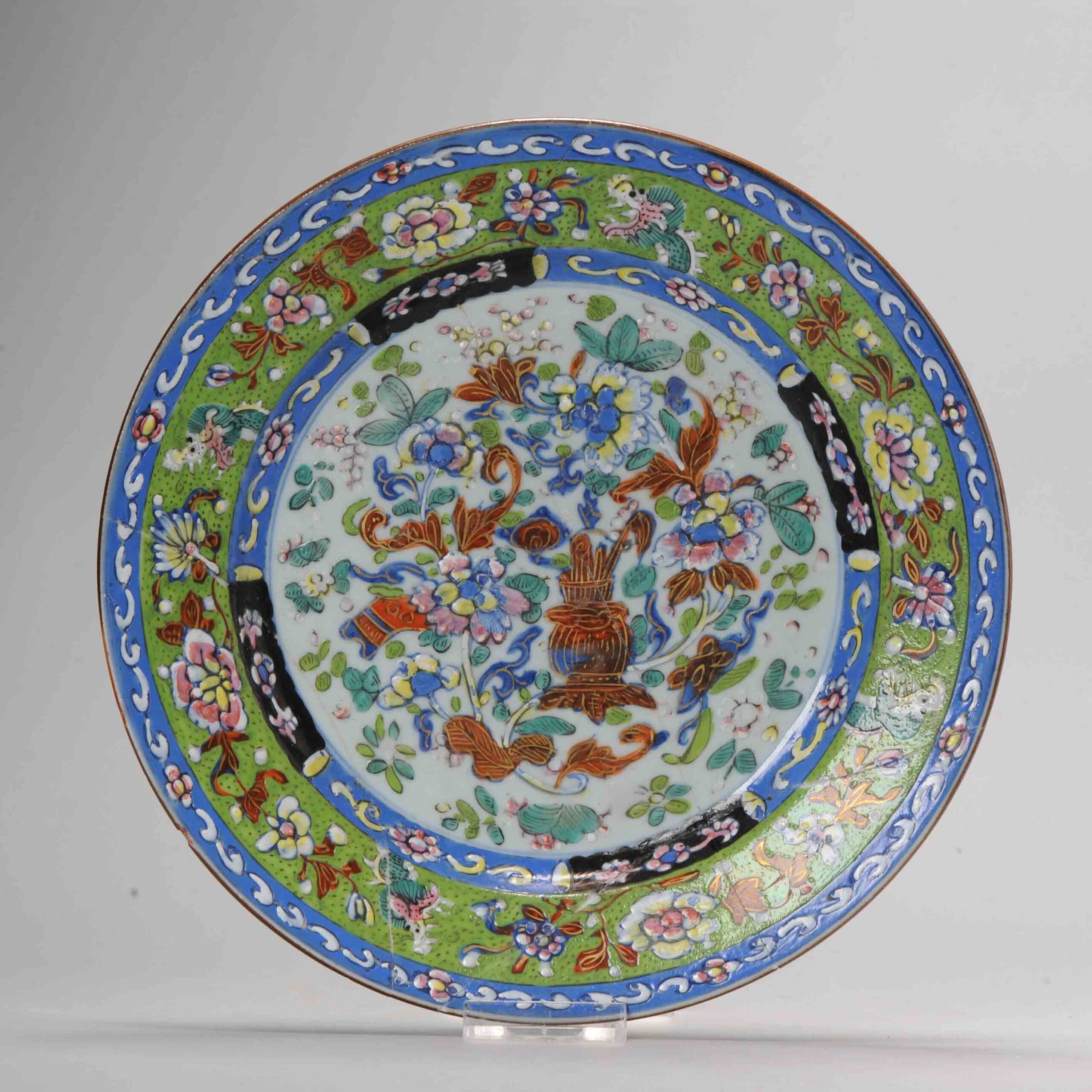 1085 Very nice decorated clobbered plate. Decorated with a underglaze in China. Overglaze red and gold, blue and black