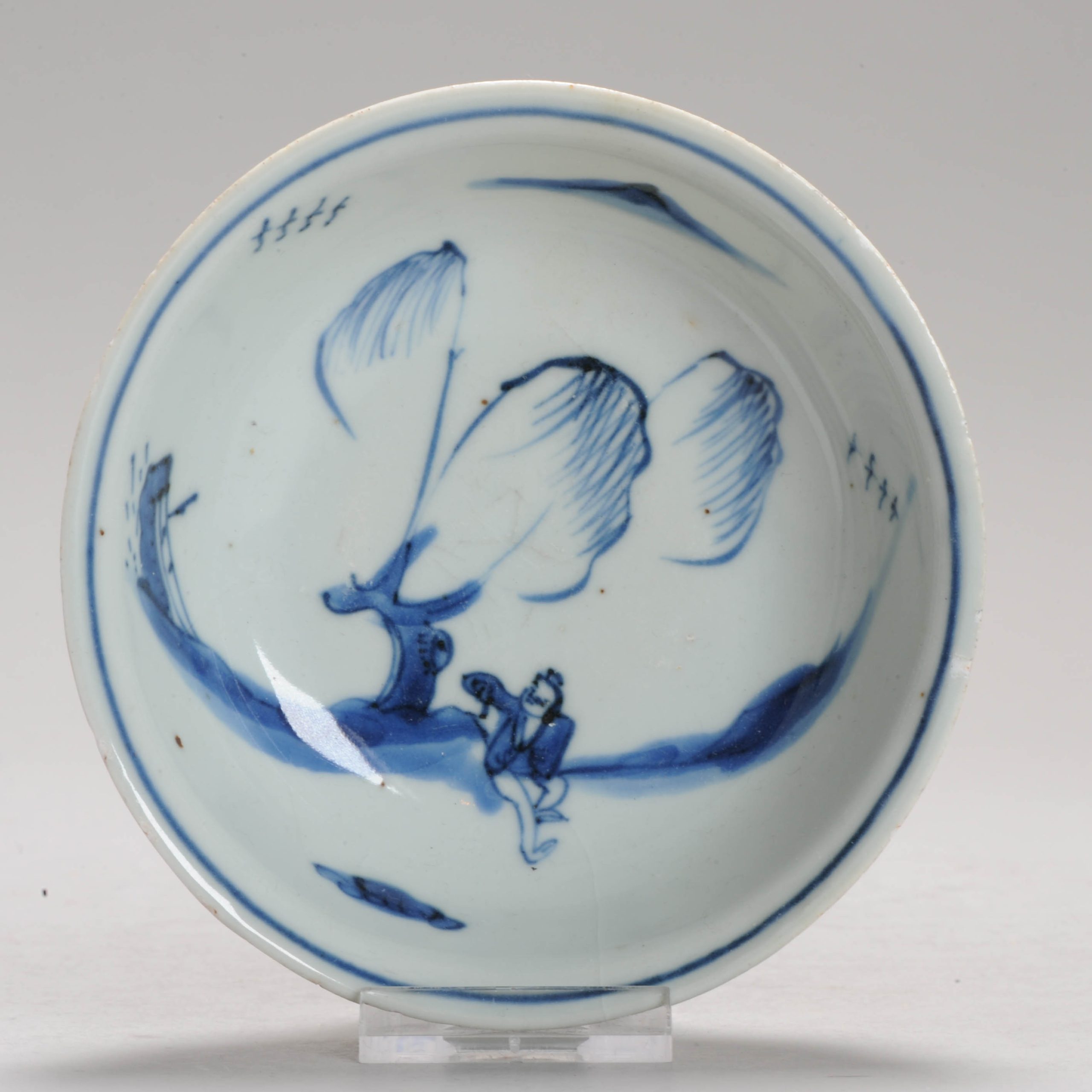 1204 A Chinese porcelain Ming Blue and White bowl with a relaxing fisherman