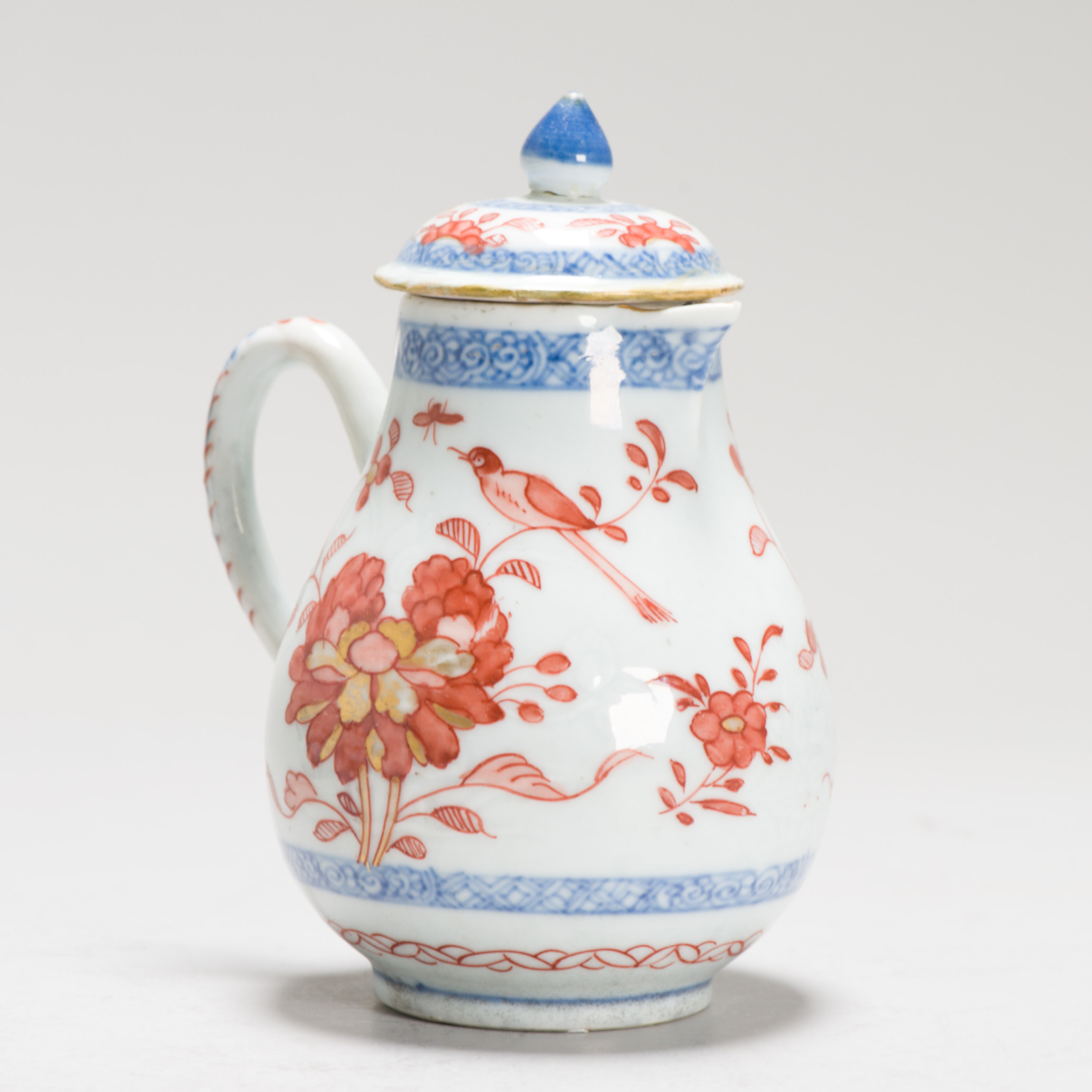 1247 A Lovely Chinese Creamer from A Teaset, decorated in red in Europe on a Chinese blue and white piece