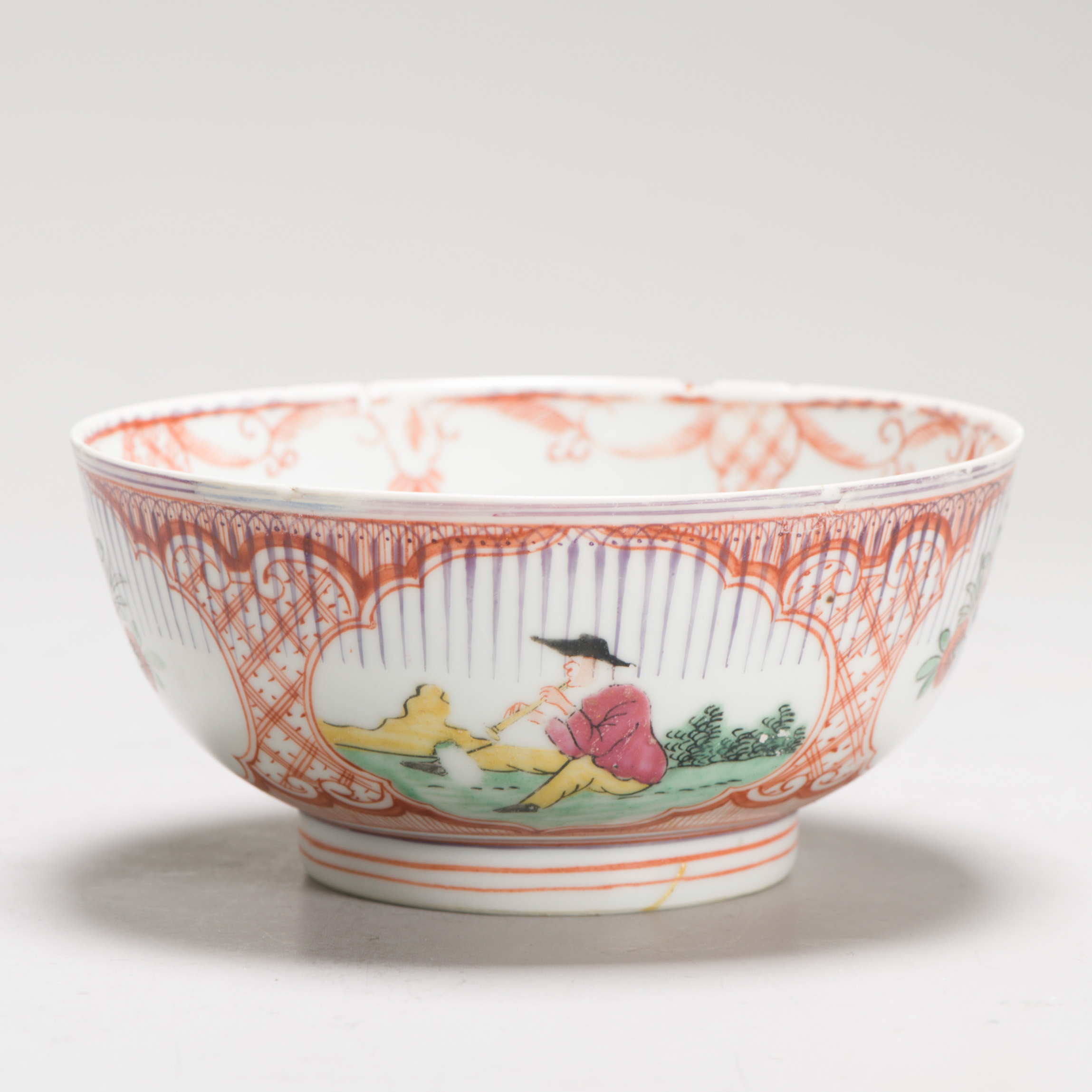 1249 An Amsterdam Bont bowl decorated in red, green yellow and purple. Surprising decoration