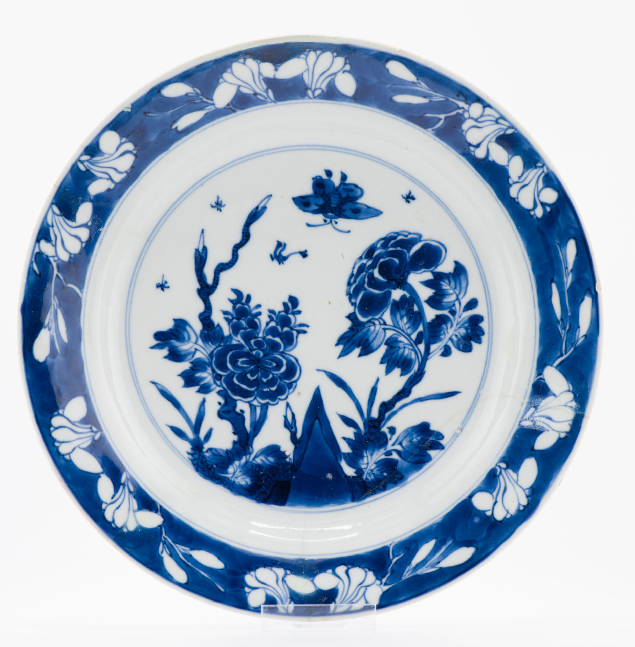 1336 Lovely cobalt blue plate with Buttefly and flowers. Very much in Ming style on the rim and base